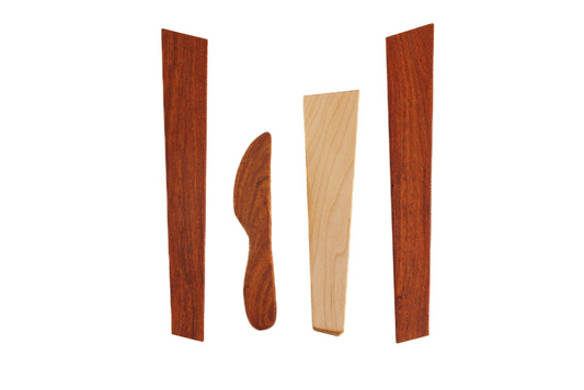 Four-piece handmade wooden utensil set featuring spreaders and spatulas in maple and cherry