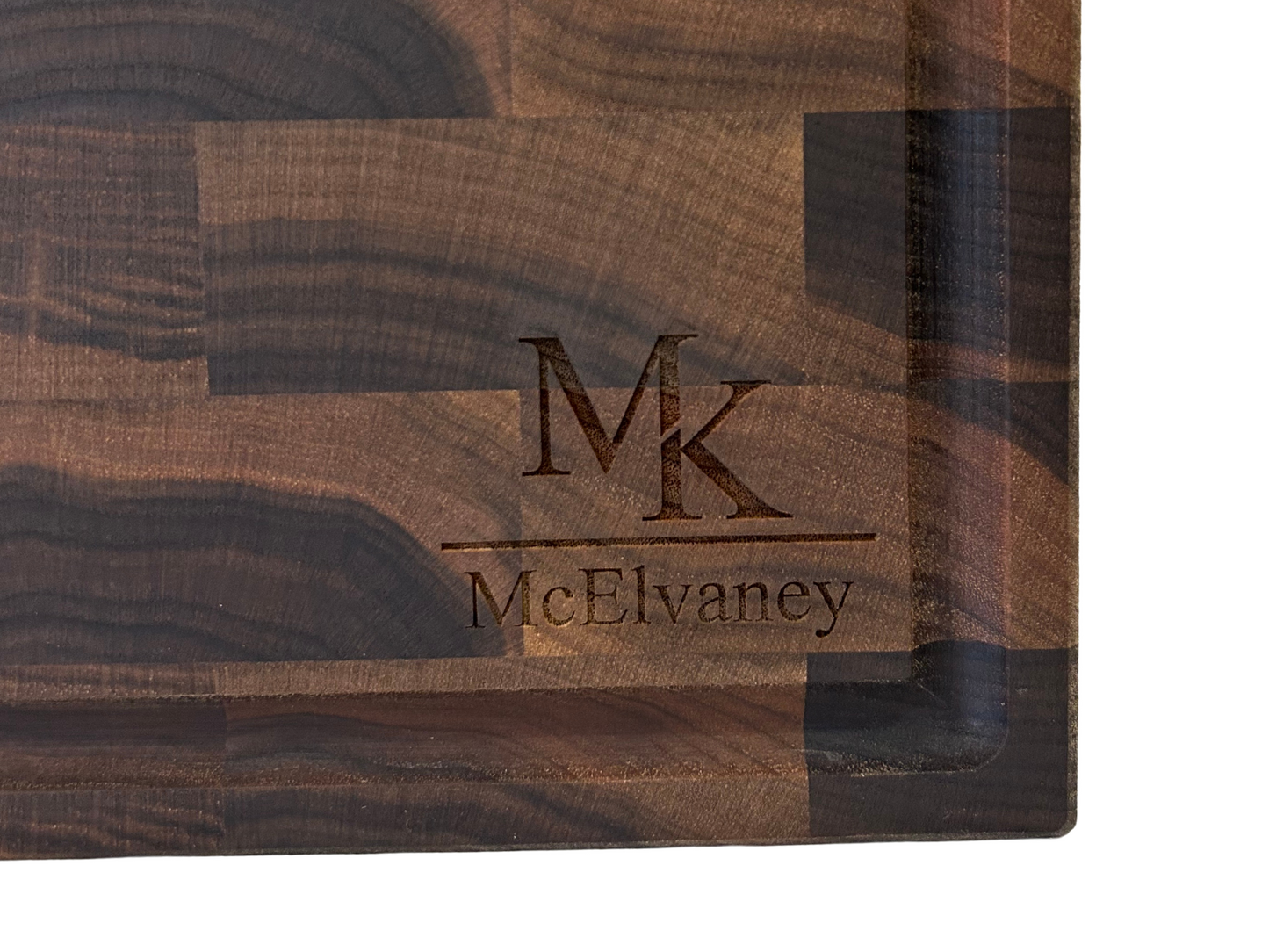 Walnut cutting board with custom MK McElvaney engraved monogram