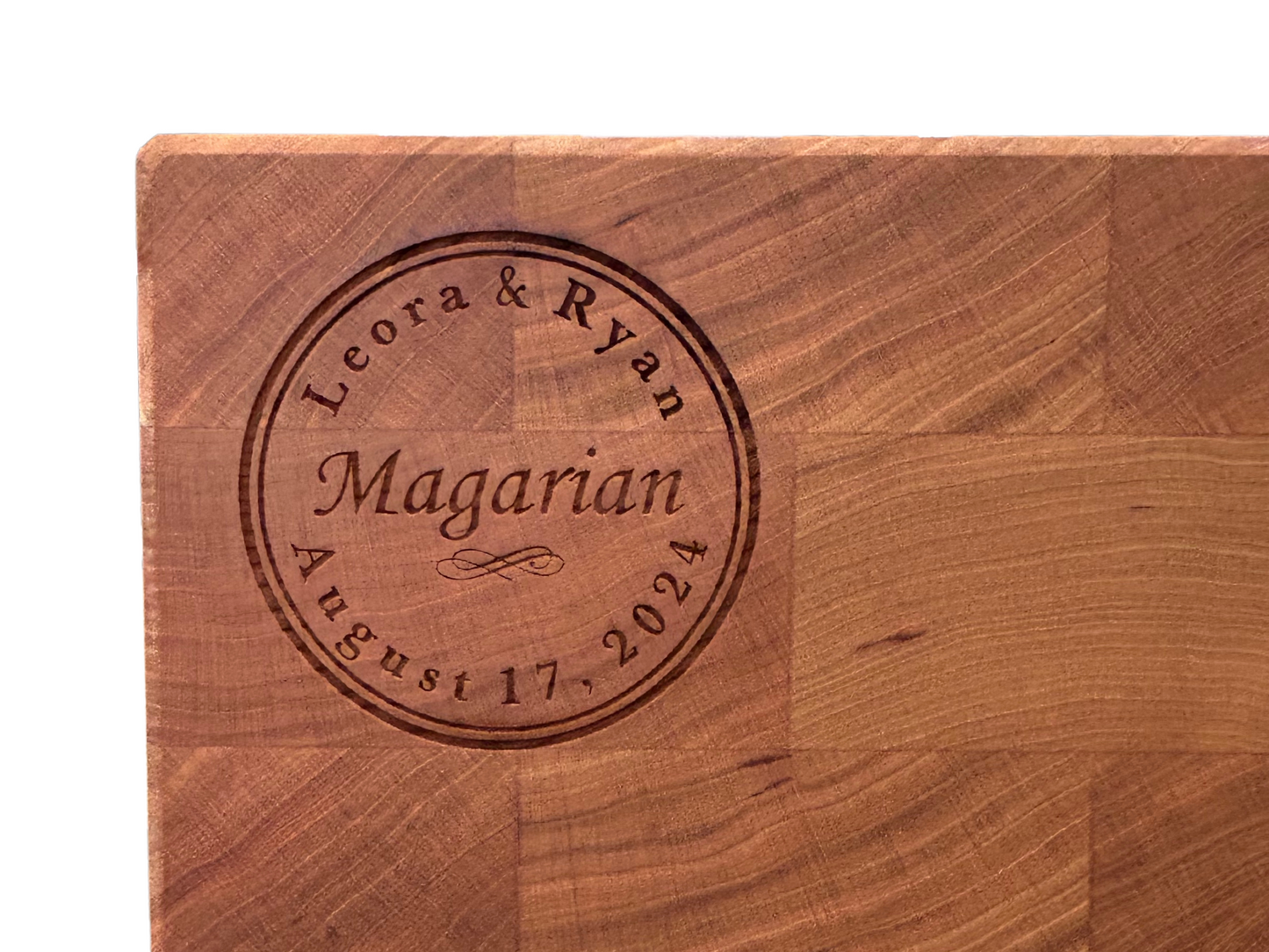 Custom engraved cherry cutting board with wedding monogram and date for Leora & Ryan